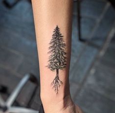 a small tree tattoo on the wrist