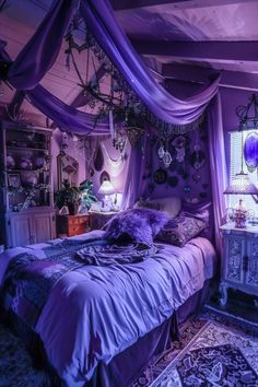 a bed with purple sheets and pillows in a room that is decorated like a fairy's castle