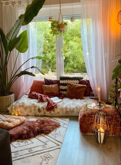 a living room filled with lots of furniture and plants on top of windowsills