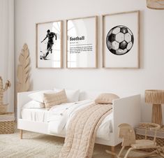 a bedroom with two pictures on the wall and a bed in front of it,