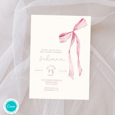 a wedding card with a pink ribbon on it