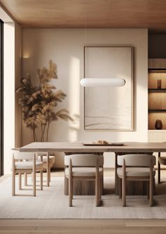 a dining room table with chairs and a plant in the corner on the far wall