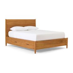 a wooden bed with white sheets and pillows