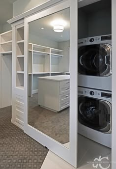 a washer and dryer are in the closet