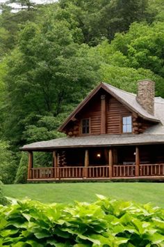 Cozy log cabin with a large porch nestled in a lush green forest. One Level Cabin, Small Log Home Plans, Cabin Exterior Ideas, Log Cabin Exterior Ideas, Log Cabin Porch, Prefab Log Cabins, Log Cabin House Plans