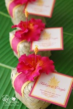 pink flowers are placed on top of the wine corks