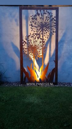 an outdoor fire pit in the shape of a dandelion