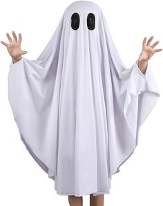 a person dressed in a ghost costume with hands out to the side and eyes closed