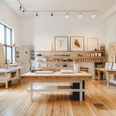 a room filled with lots of wooden furniture and art on the wall above it's shelves