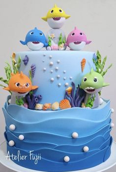 there is a blue cake decorated with sea animals