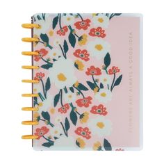 a pink notebook with yellow pencils sticking out of the cover and flowers on it