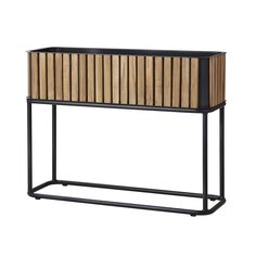 a wooden and metal console table with an open drawer on one side, and a black frame