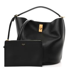 This is an authentic CELINE Smooth Calfskin Bucket 16 Bag in Black. This ultra-chic shoulder bag is crafted of smooth calfskin leather in black. This shoulder bag features a leather handle and an optional shoulder strap with gold hardware including a turn lock closure. The top opens to a black suede leather interior with a matching removable pouch. Black Leather Bucket Bag, Celine Bucket Bag, Celine Box, Leather Bucket Bag, Leather Interior, Black Cross Body Bag, Flap Bag, Black Suede, Leather Handle