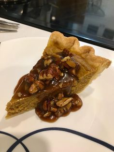 a slice of pecan pie on a white plate