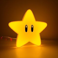 a yellow star shaped light sitting on top of a table