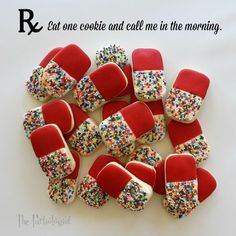 red and white cookies with sprinkles are arranged in the shape of mittens