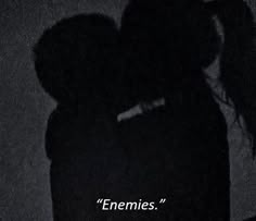 two people standing next to each other in front of a dark background with the caption'emeries '