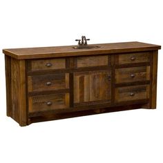 a bathroom vanity with wooden drawers and a metal faucet on the sink counter