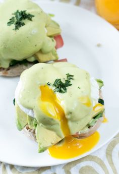 an open face sandwich with avocado sauce on it