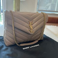 Brand New Ysl Saint Laurent Shoulder Bag In Overstitched Y-Quilted Leather - Sleek, Leather Bag Perfect For Everyday Chain And Leather Shoulder Straps; 19.29" Drop Unfolded, 9.84" Drop Folded Can Be Worn Doubled On The Shoulder Envelope Flap With Ysl Logo; Snap Closure Bronze Metal Hardware Zip Pocket Divides Interior; One Zip And One Slip Pocket Fabric Lining 8.6"H X 12"W X 4.7"D Approx. Weight 2.1 Lb. Made In Italy Yves St Laurent Bag, Lux Purse, Ysl Lou Camera Bag, Ysl Purse, Ysl Handbags, Kate Bags, Ysl Saint Laurent, Birkenstock Boston Shearling, Boston Shearling