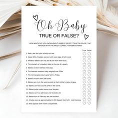 a baby's true or false checklist is shown on top of some feathers