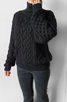 Gorgeous cable knit oversize sweater. 100% handmade ❤ Perfect quality.  The composition is 50% alpaca, 50% merino wool  Color: black  Collar: stand  Measurements of the sweater on the photo: - sweater width - 55 cm / 21.6 in - sweater length - 63 cm / 24.8 in - sleeve length (from neck to wrist) 70 cm / 27.5 in - collar length 11 cm / 4.3 in  I can make a custom SIZE according to your measurements. If you need change sweater width, sweater length, sleeve length or collar length please let me know.  If you would like another COLOR for your sweater please let me know.  Your sweater will be 100% handmade. Please, allow me 2 weeks to knit and ship out.  Free worldwide shipping If you have any quetions, please, send me message 😊   Dear knitters! Please do not use my photo to advertise your wor Black Merino Wool Crew Neck Sweater, Black Long Sleeve Knit Sweater, Merino Wool Crew Neck Chunky Knit Sweater, Cold Weather Textured Merino Wool Sweater, Cozy Slouchy Cable Knit Sweater, Black Merino Wool Casual Sweater, Oversized Wool Sweater With Textured Knit, Oversized Textured Knit Wool Sweater, Casual Black Merino Wool Sweater