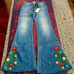 Pylo Brand Flower Embroidered Detail Flare Jeans. Size 27 New With Tags. Super 70’s!! Actual Waist Is 26” Rise 8” Inseam 34” Stretch Flower Patches On Jeans, Colorful Bell Bottoms, Flare Jeans With Designs, Floral Painted Jeans, Embroidered Fitted Jeans For Spring, Fitted Embroidered Jeans For Spring, Spring Embroidered Fitted Jeans, Bohemian Fitted Jeans With Floral Embroidery, Fitted Bohemian Jeans With Floral Embroidery