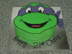 a green cake with a teenage mutant on it's face and the words happy 21st birthday