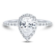 an engagement ring with a pear shaped diamond in the center and pave set shoulders