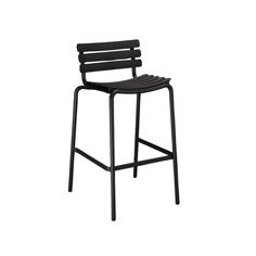 a black plastic bar stool with an armrest and slatted seat, viewed from the front