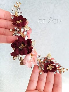 a hand holding some flowers in it's palm with the words grace on it