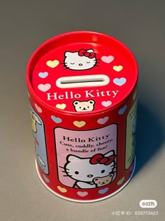 a hello kitty candy tin on a table