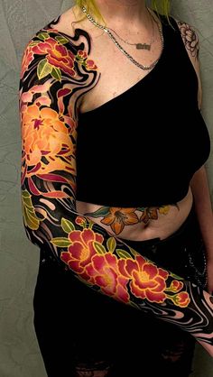 a woman with tattoos on her arms and arm