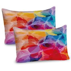 two pillows with colorful shapes on them