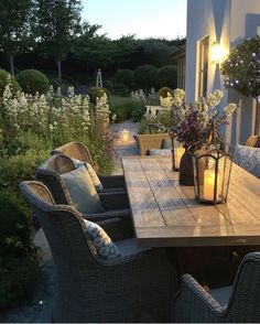 a wooden table sitting on top of a patio