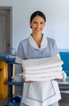 Maid working at a hotel changing the towels Hotel Maid Aesthetic, Hotel Maid, Housekeeping Dress, Amazon Cleaning, Travel Brochure Design, House Maid, Hotel Jobs