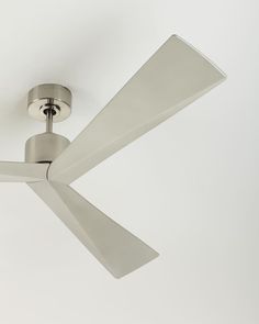 a ceiling fan in a white room with a light on the ceiling and two blades attached to it