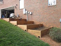 the outside of a brick building with wooden steps leading up to it