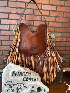 Handcrafted American Genuine Leather bag is designed by American Darling here in the heart of Texas. These gorgeous creations deliver a blend of Western culture and heritage along with the latest fashion and trendy appeal. Eco-friendly genuine leather is handpicked and sourced from some of the best tanneries in the world. The bag is made by highly experienced and skilled craftsmen of the industry using the highest quality standard of production. This handmade American Darling women's detailed ha Leather Purse Pattern, Handmade Leather Purse, Saddle Blanket, Fringe Purse, Western Culture, Hobo Purse, Stylish Handbags, Cross Body Purse, Hand Tooled Leather