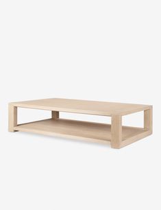 the coffee table is made from wood and has two shelves on each side, with one shelf below it