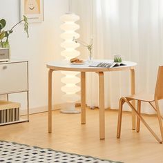 a white table and chair in a room