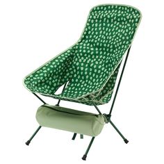 a green and white polka dot lawn chair with an ironing board attached to it