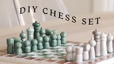 a chess set sitting on top of a wooden table next to a white chair with the words diy chess set written over it