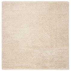 a white area rug with some very soft furnishing on the top and bottom