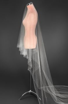 a mannequin with a veil on top of it