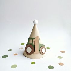 a wooden toy tractor with a number one on it