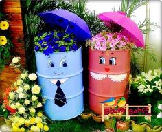 three buckets with plants and flowers in them are painted like people holding umbrellas