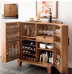 a wooden cabinet filled with lots of bottles and glasses