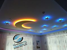 the ceiling is decorated with blue lights and stars