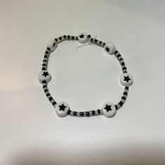 a black and white beaded bracelet with stars